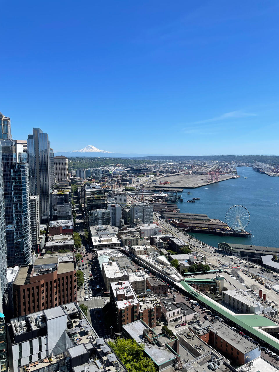 Seattle rooftop onlooking Pike Place Market and Mount Rainier.